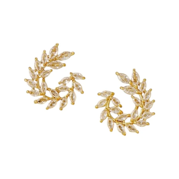 Aretes Amelie Oro Aretes tipo trepadores dorados con diseño de hojas y zirconias brillantes oro laminado 14k.