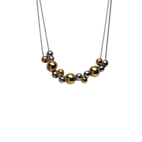 Collar de doble cadena modelo Aura con esferas combinadas en oro y plata acero inoxidable.