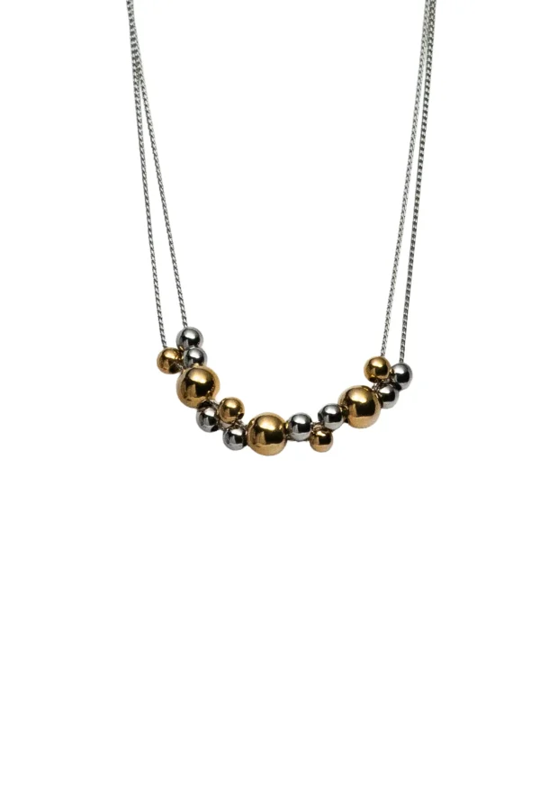 Collar Aura Bicolor Collar de doble cadena modelo Aura con esferas combinadas en oro y plata acero inoxidable.