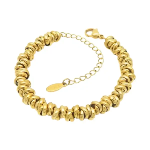 Pulsera gruesa dorada de mujer con diseño de nudos entrelazados modelo Anaïs en acero.