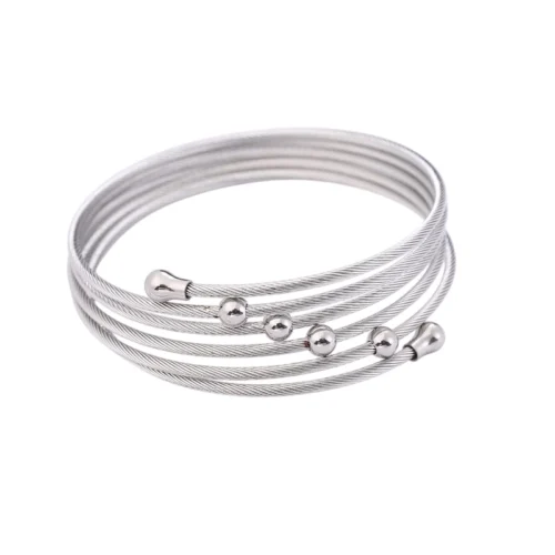 Brazalete Véla Plata Pulsera tipo cuff plateada de acero inoxidable diseño multicapa estilo industrial.