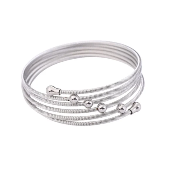 Brazalete Véla Plata Pulsera tipo cuff plateada de acero inoxidable diseño multicapa estilo industrial.